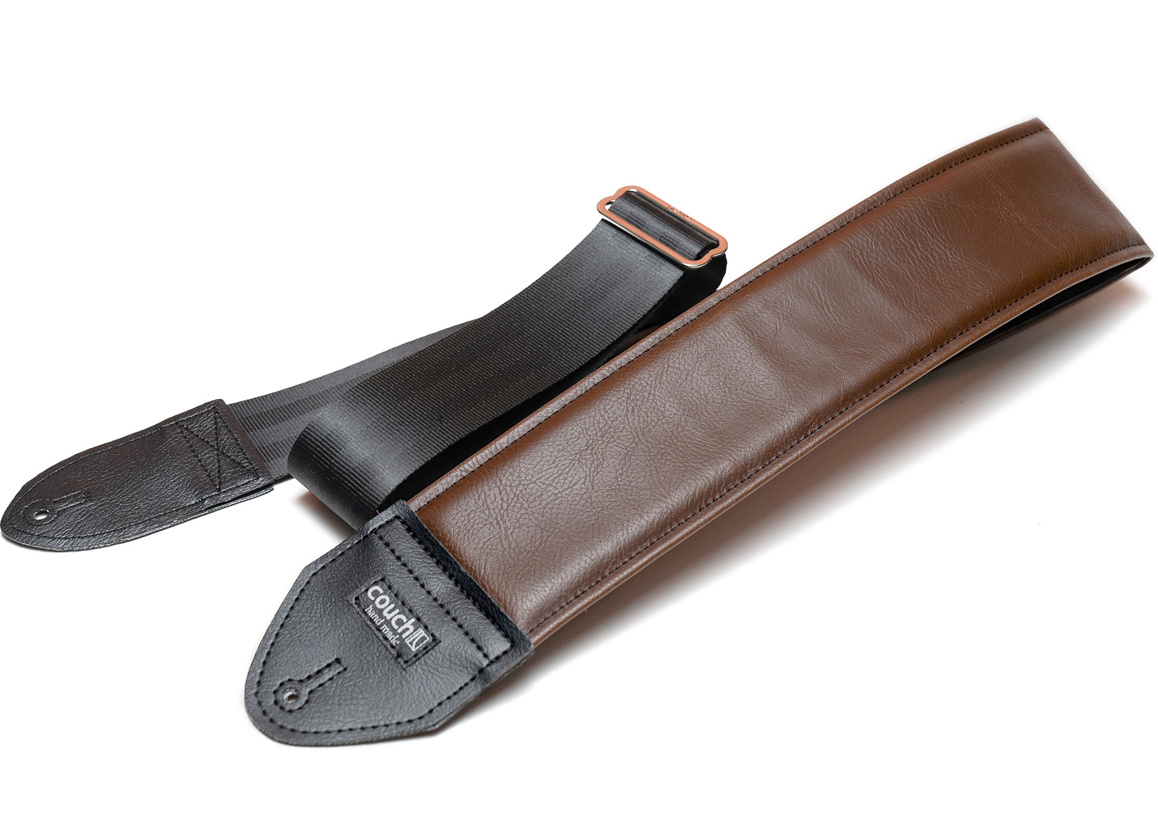 The classic brown 3 inch padded strap with black end tabs and a seatbelt tail