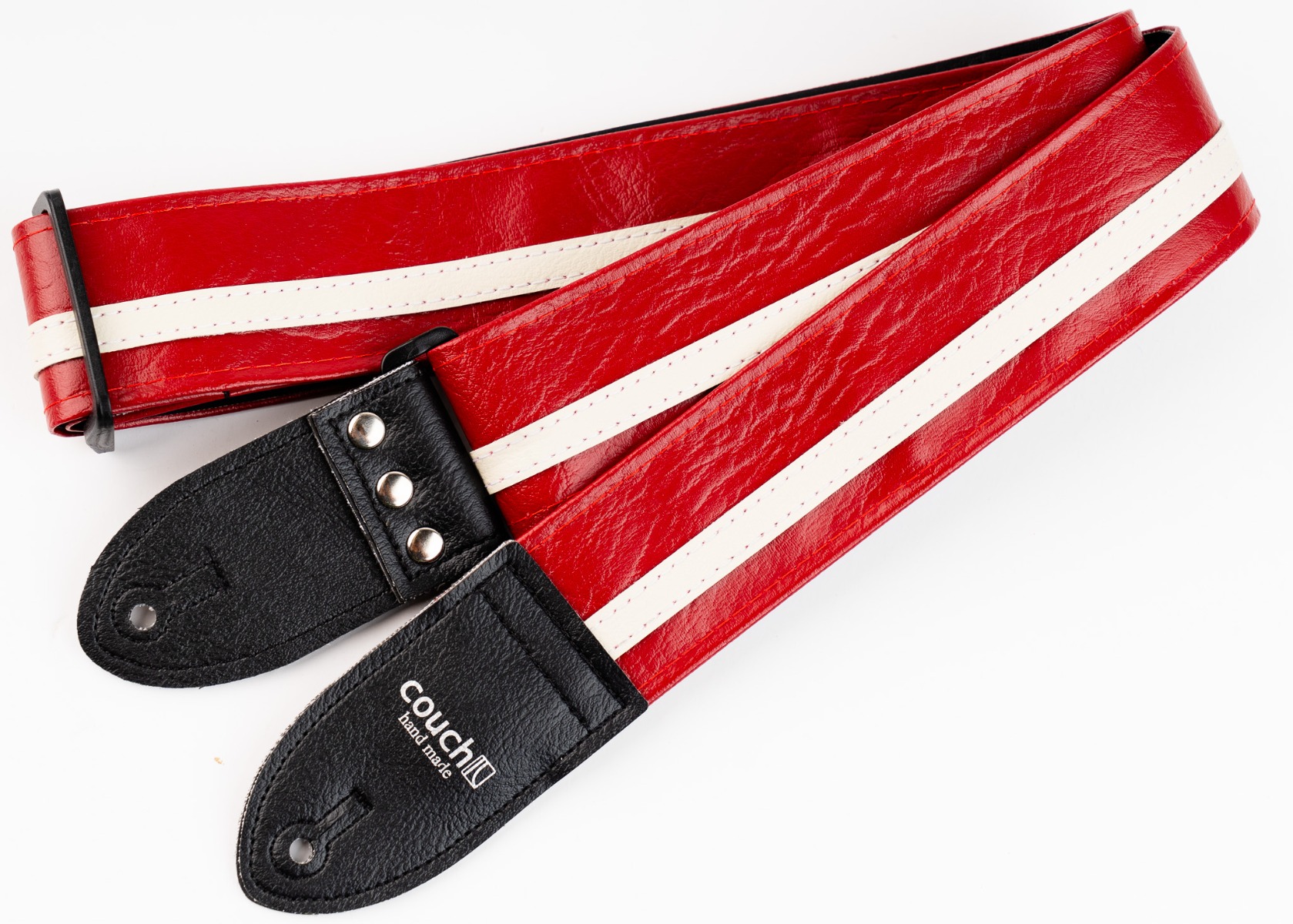 The Vintage Cadillac Red Racer-X guitar strap in high-gloss red vinyl with a cream racing stripe