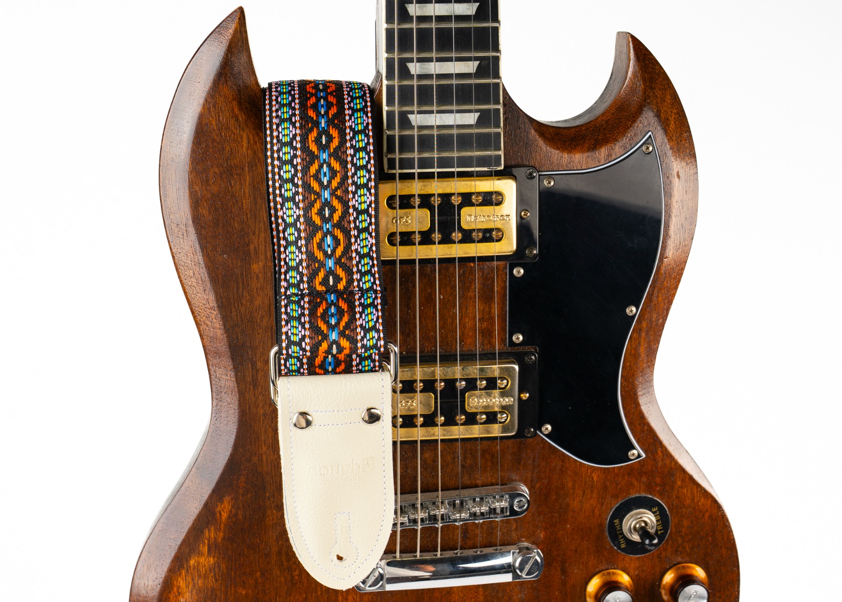 The Turquoise Desert strap worn on a mahogany SG-style guitar