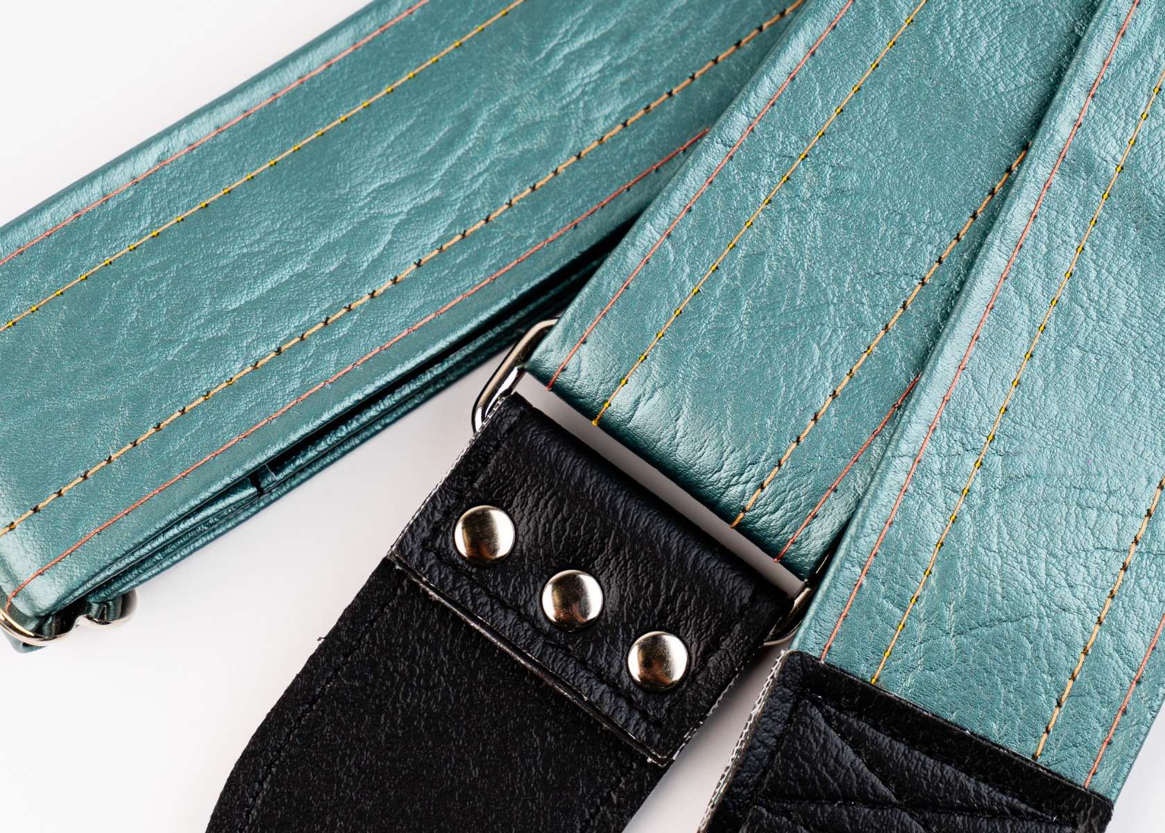 Detail of the Selenium strap showing the grain of the vinyl and the riveted tab