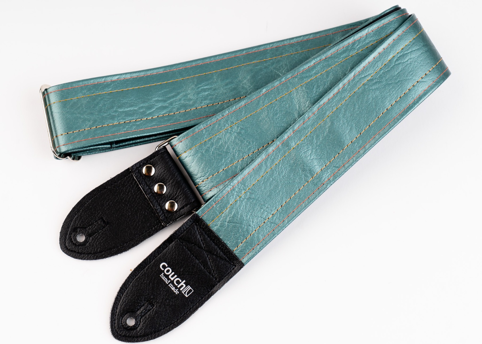 The Selenium Vintage Cadillac guitar strap in metallic sea-green vinyl with black vinyl tabs