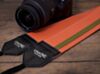 The Orange and Army Racer X Camera Strap 