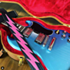 Gibson SG in placid blue with bolt guitar strap