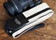 The Couch White w/ Black Racer X Camera Strap 