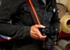 The Couch Brown and Orange Racer X Camera Strap