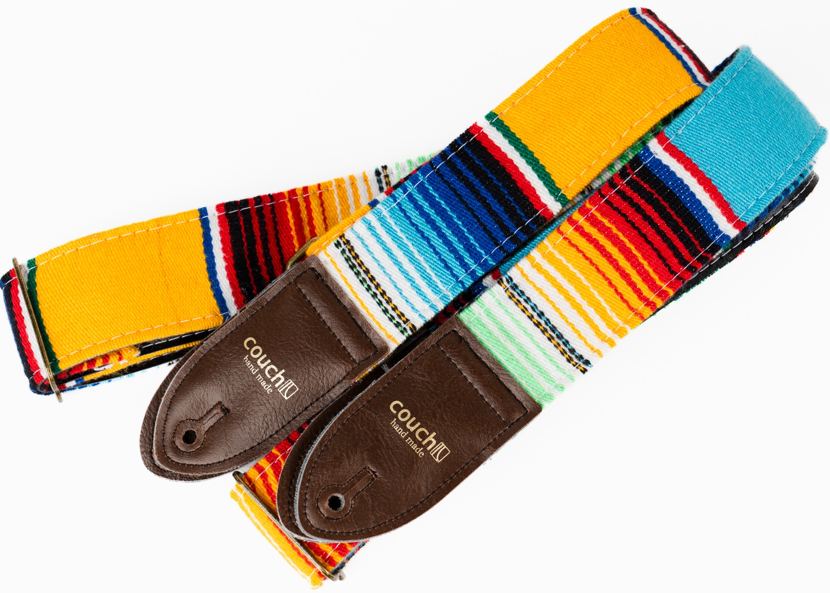 The blue and yellow serape guitar straps side by side with brown vegan leather ends