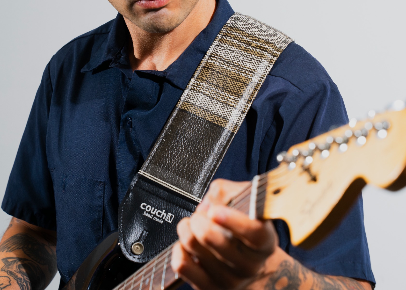 The vintage 3 inch strap worn on a guitar