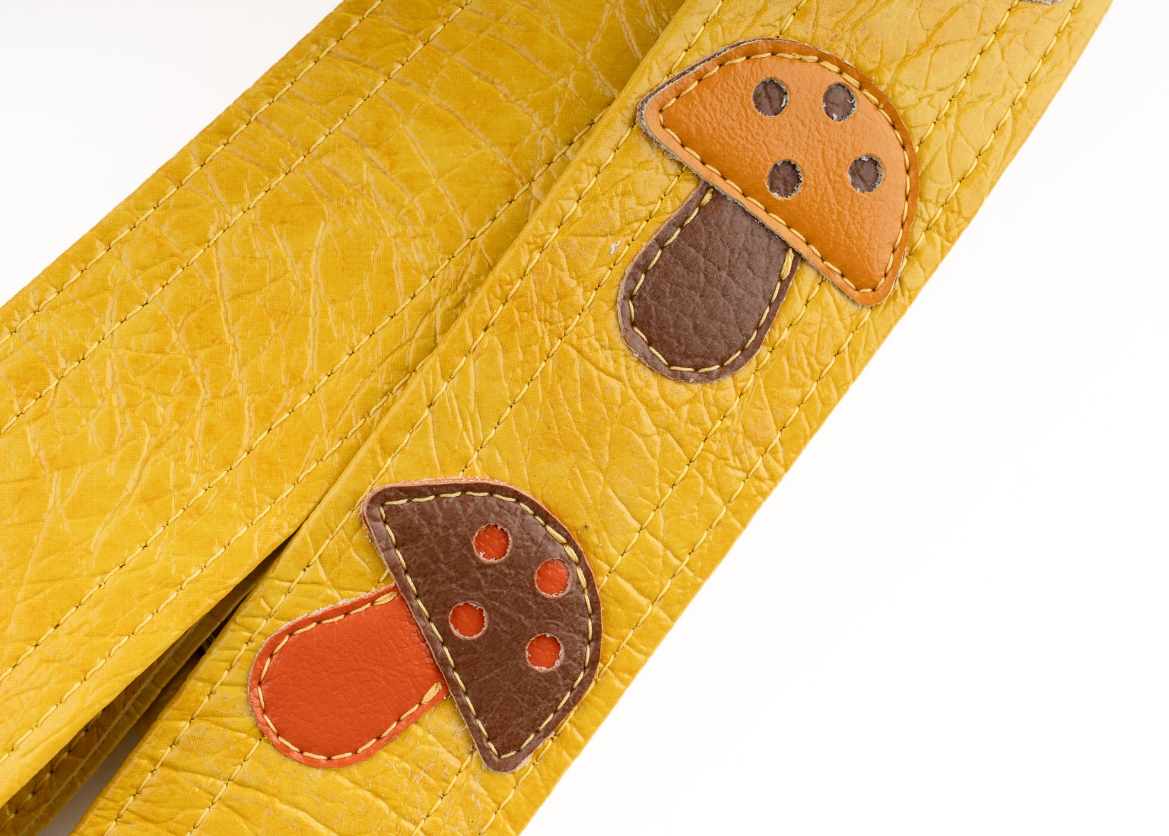 Close-up of the hand-sewn two-piece mushroom appliques