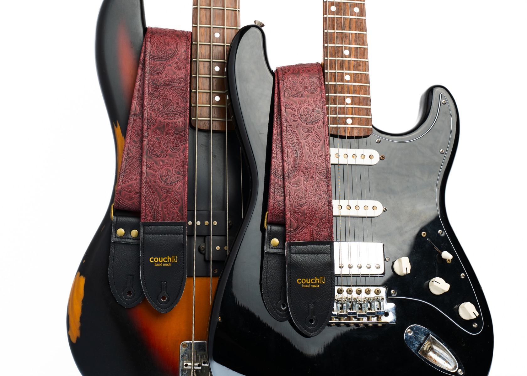 The paisley oxblood guitar strap worn on a sunburst Stratocaster