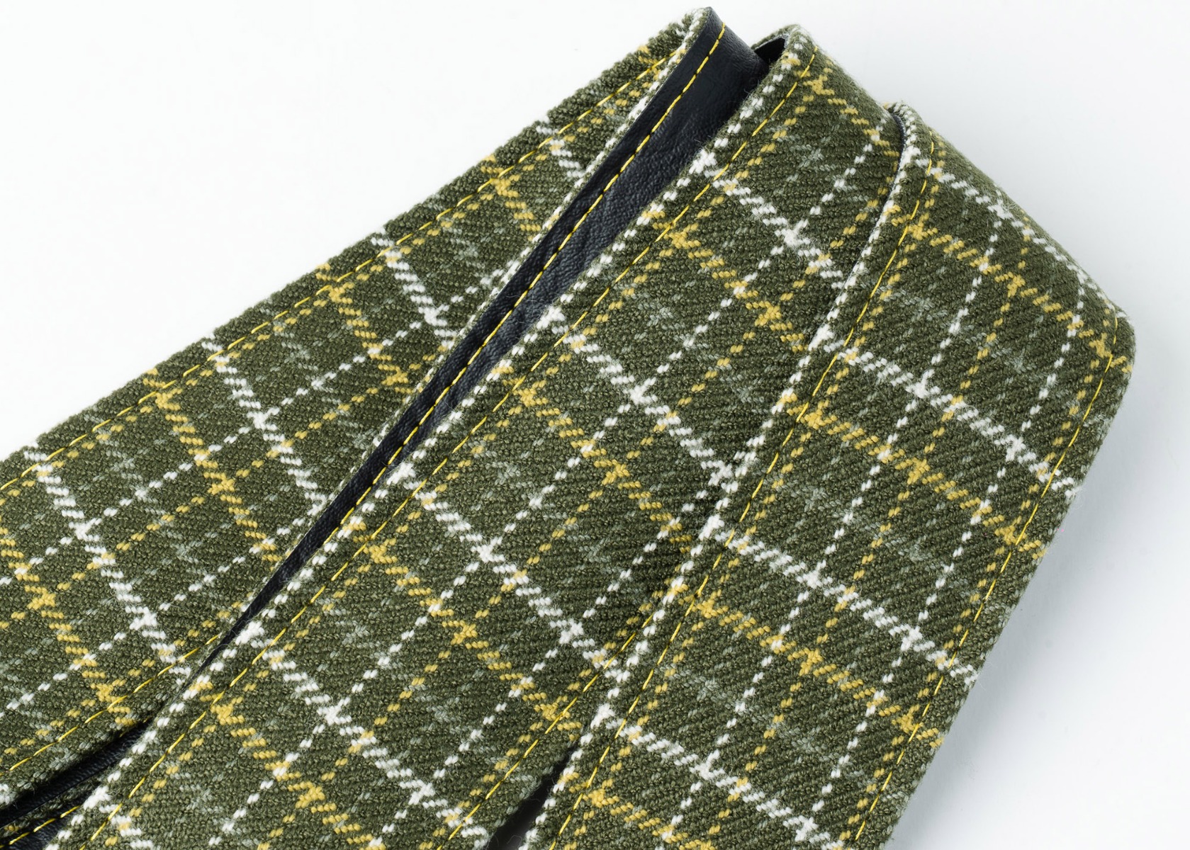 Close-up of the olive plaid weave with white and gold windowpane check