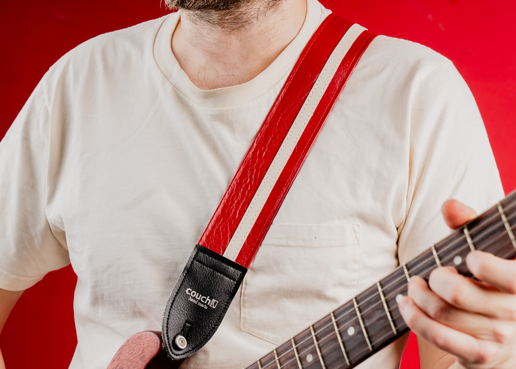 The Vintage Cadillac Red Racer-X guitar strap being worn with an electric guitar