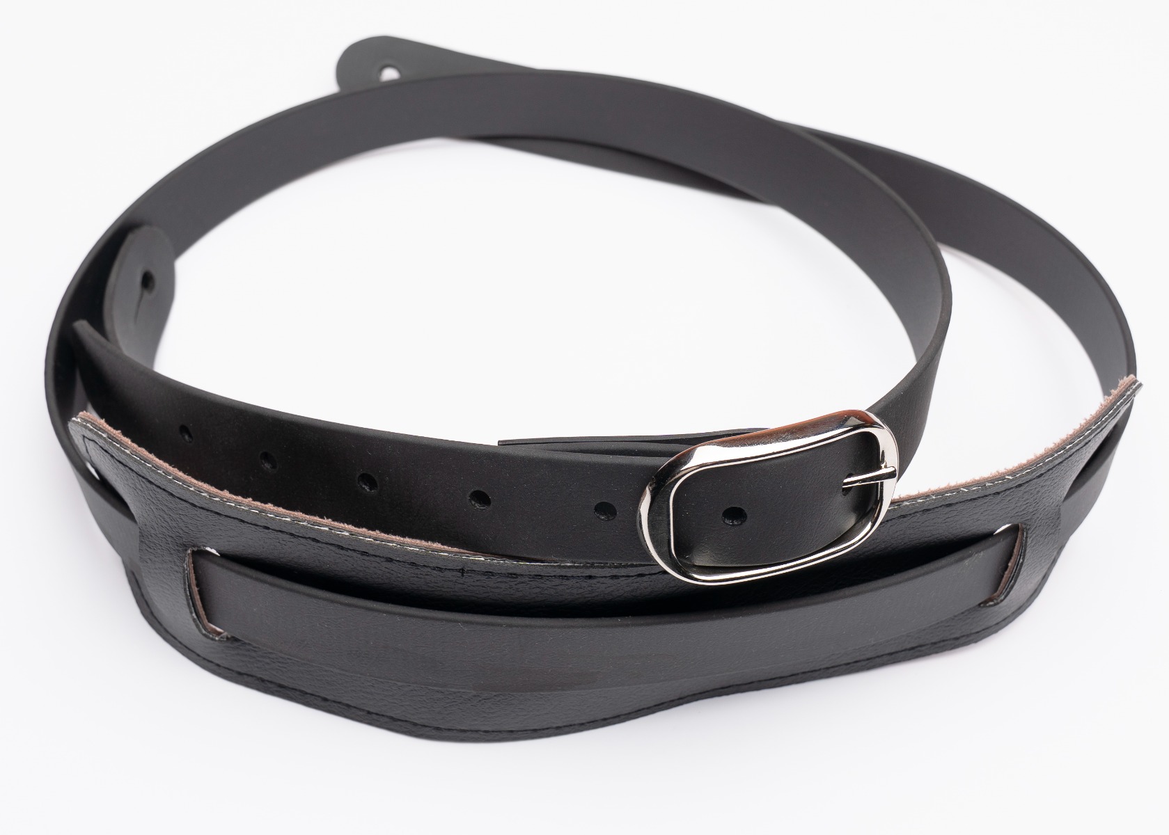 The Slim Vintage guitar strap in black BioThane with an oval buckle and punched holes