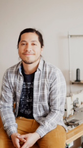 NIC GONZALEZ  <br>PRODUCTION, WHOLESALE AND CUSTOMER SERVICE <br>Nic studied music in college and also likes to get paid regularly to take the stage with his standup bass and play some score, and will rock out too because that’s how he is. He also managed a music store so besides being a killer musician and good guy, he’s our liaison with the amazing network of independent music stores that carry Couch. 